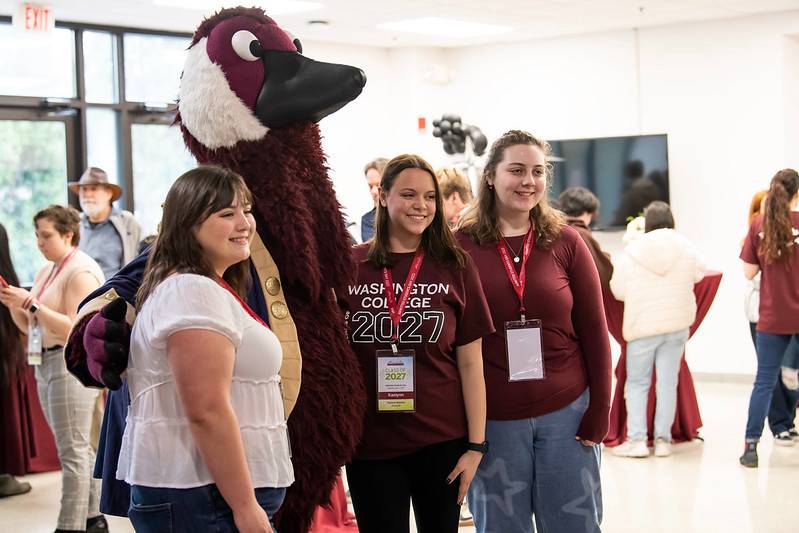 Admitted students posing with Gus for a photo