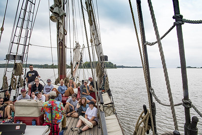 students on a historic sailboat, the sultana, listening to a lecture