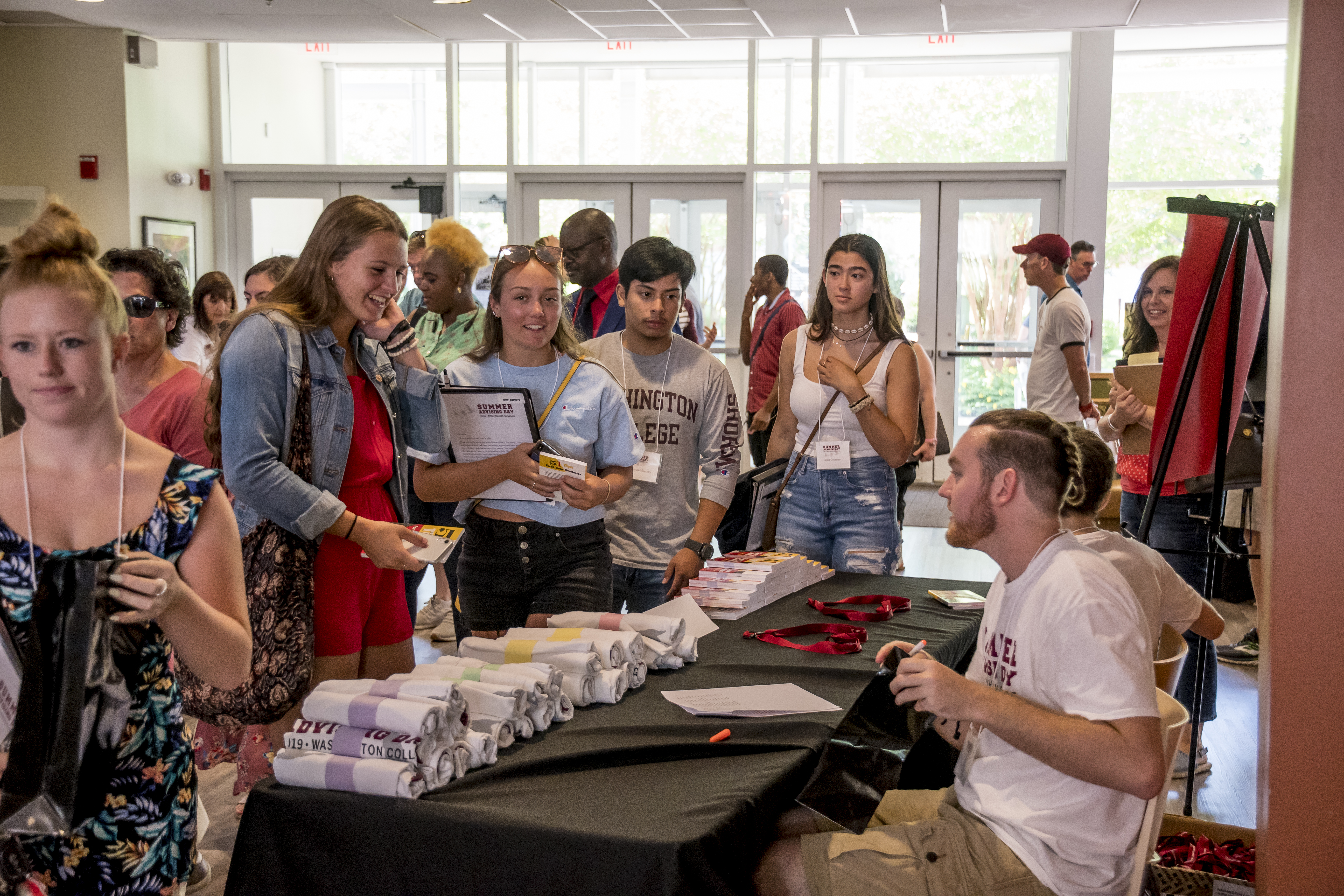 Students in line picking up t-shirts.
