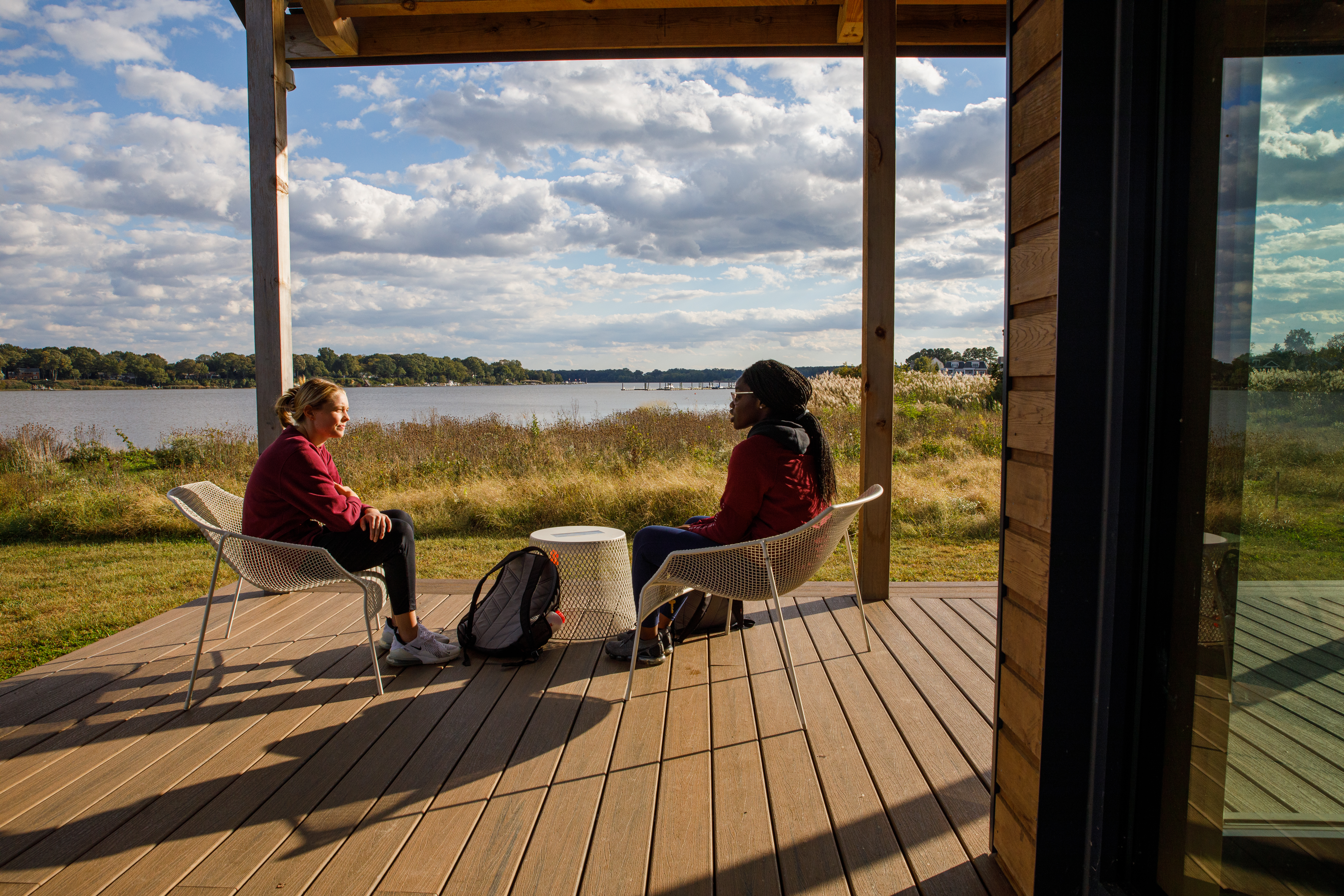Washington College students sit by the waterfront