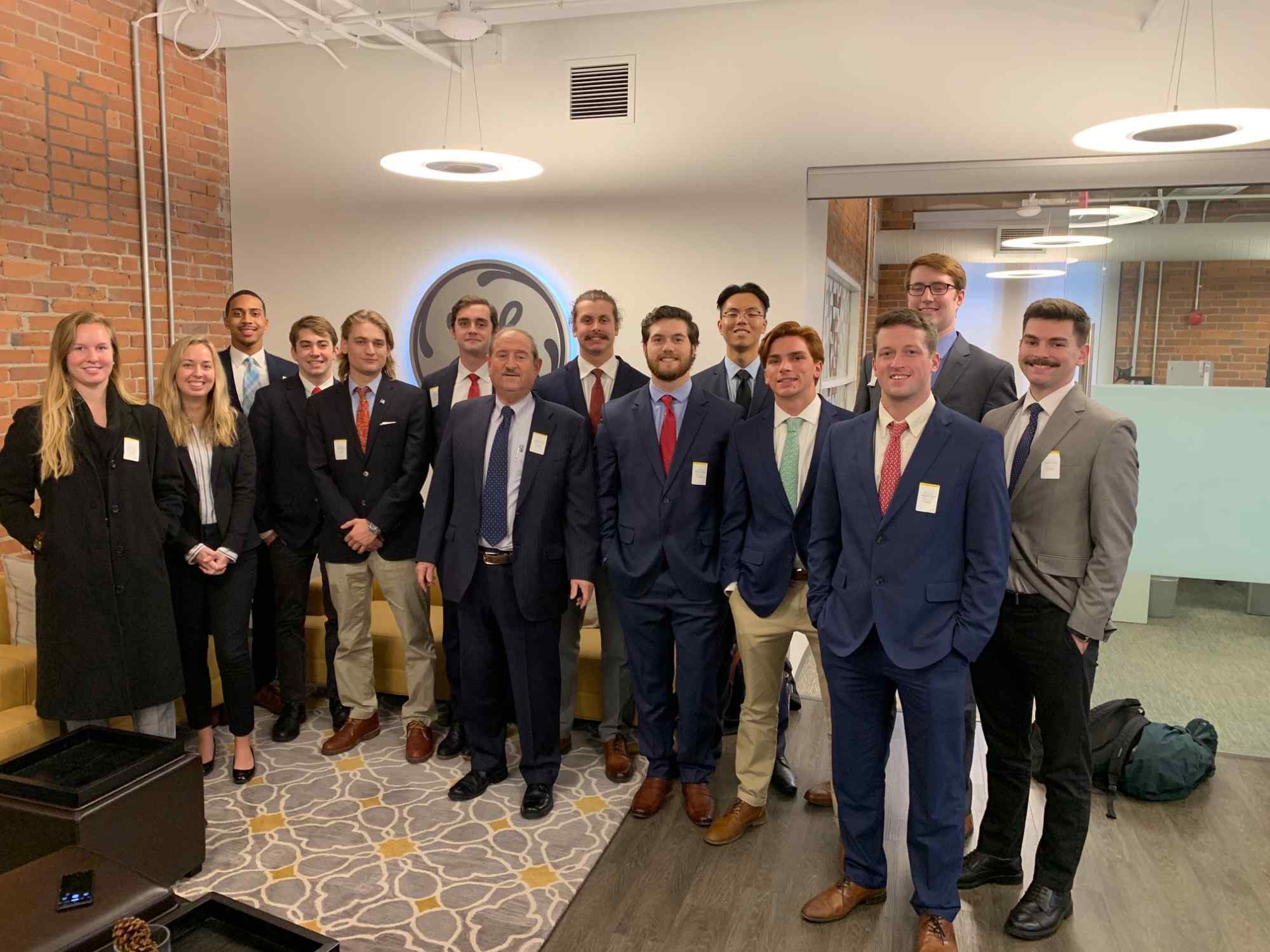 Thirteen Washington College students pose for a photo in General Electric's Boston Office in 2019 as a part of the Brown Advisory Student-Managed Investment Fund.