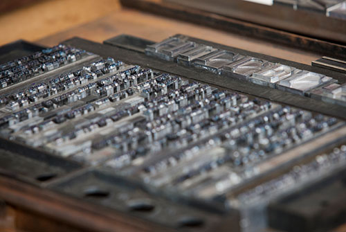 Letterpress metal letters in printing press