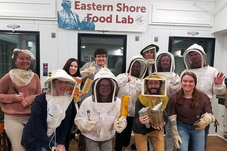 Students learn how to become beekeepers.