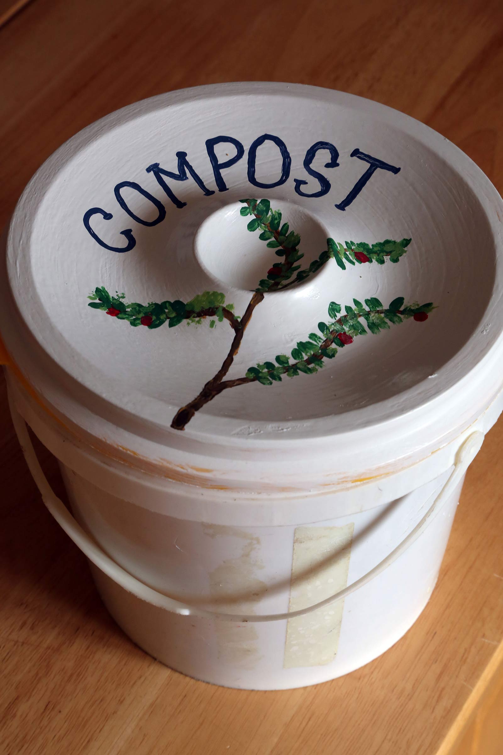 A salvaged bucket fits inside a kitchen drawer or cabinet for easy food scrap collection.