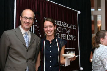 A Washington College junior fellow and faculty member pose for a photo at the Douglass Cater Society mixer in 2014