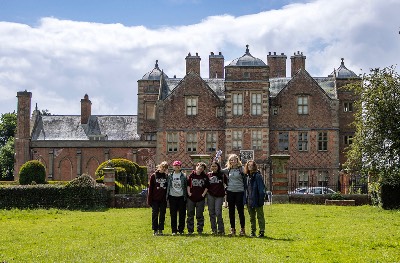 a group of Washington College students stand outside of Kiplin Hall, the ancestral home of the Calverts in England