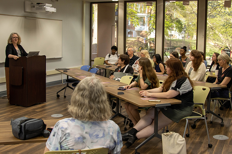 Jennifer Nesbitt, executive assistant to the dean of library and academic technology, runs the Thornton Research Prize process and here addresses the audience at the award ceremony.