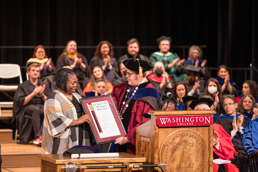 President Mike Sosulski presents a Joseph L. Holt Distinguished Service Award to Lisa Moody, associate director of the center for career development.