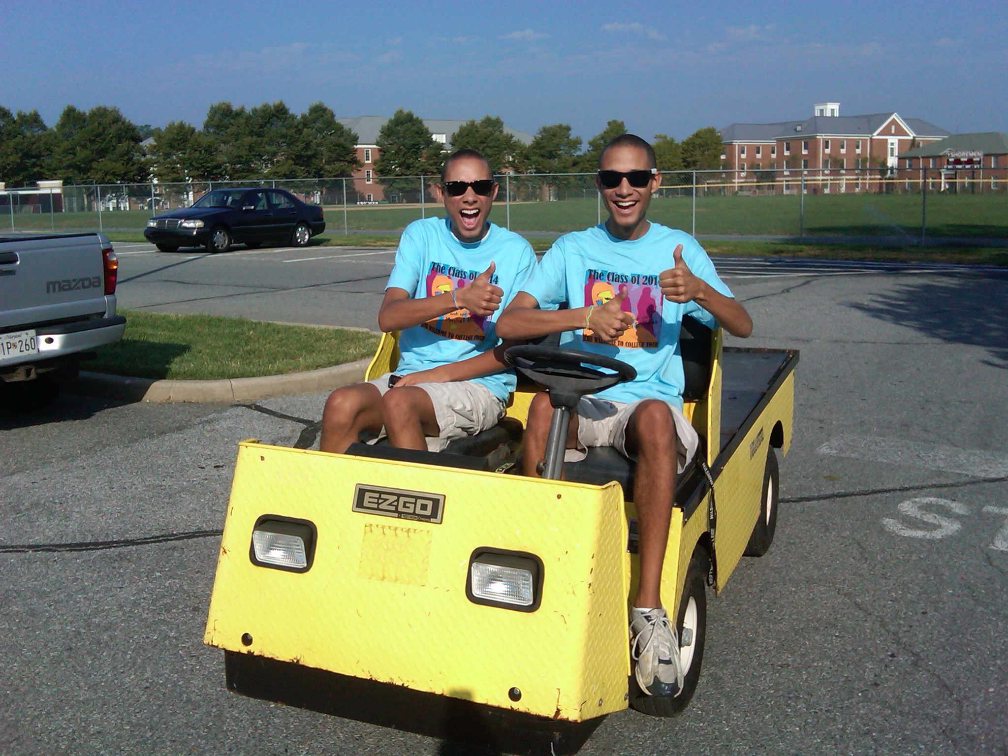 Antoine Jordan and a friend riding golf cart