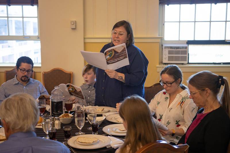 Sara Clarke-De Reza reads from the Haggadah for Hillel's Intersectional Seder