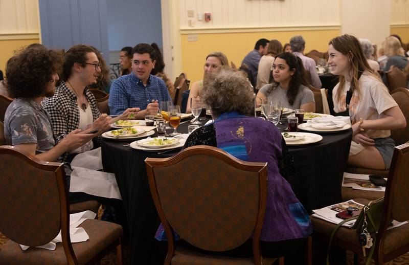 Students and community members enjoy the Seder together
