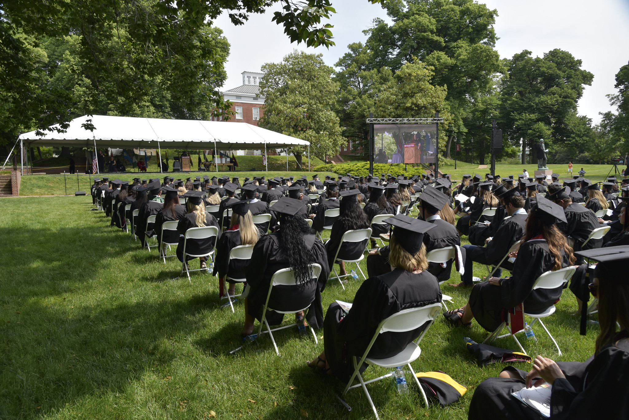Graduates seated on the Campus Lawn during 2021 Commencement