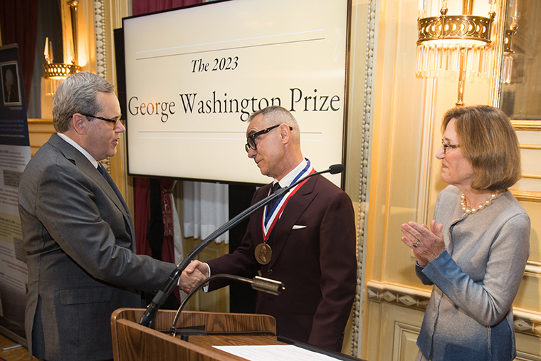President Mike Sosulski congratulates Maurizio Valsania on winning the Washington Prize.