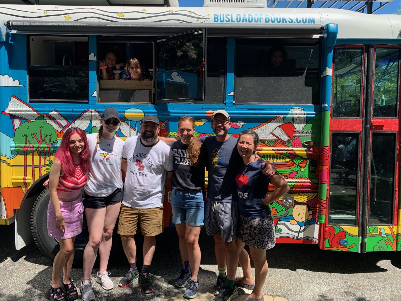 Washington College students and faculty stand in front of Busload of Books school bus before the tour began.