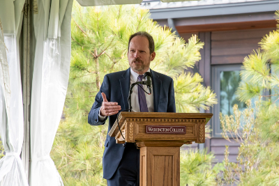 John Seidel speaking at a podium 