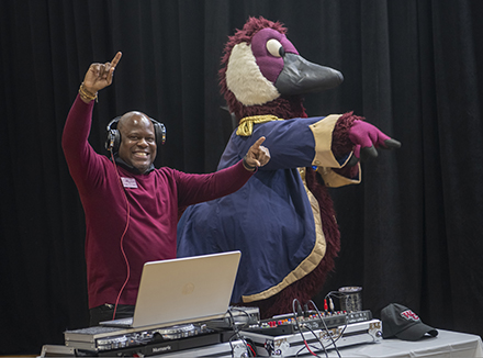 VP of Enrollment Management Johnnie Johnson deejays as Gus the Goose pumps up the crowd