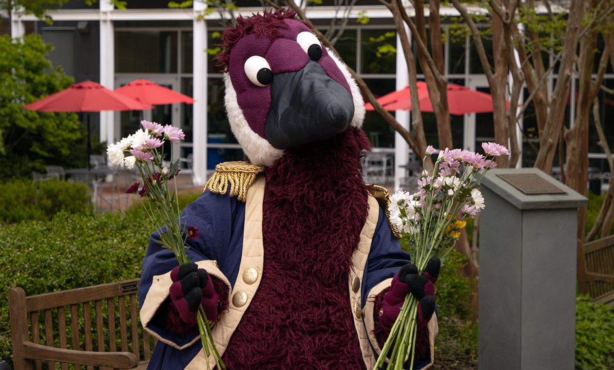 Gus the Goose delivering flowers around campus