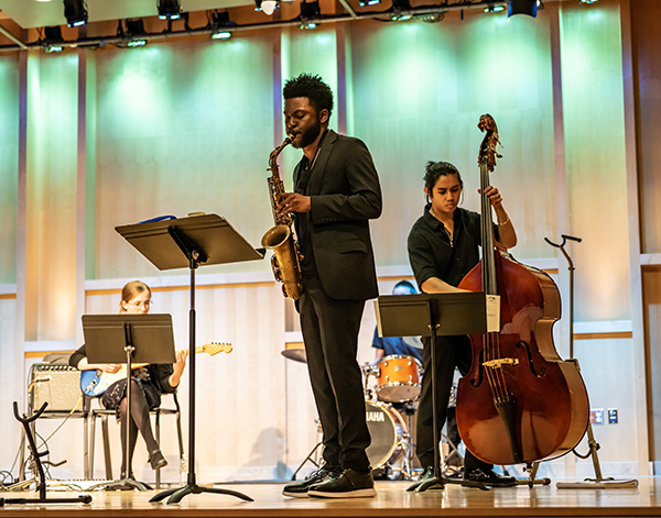 students perform on the hotchkiss stage