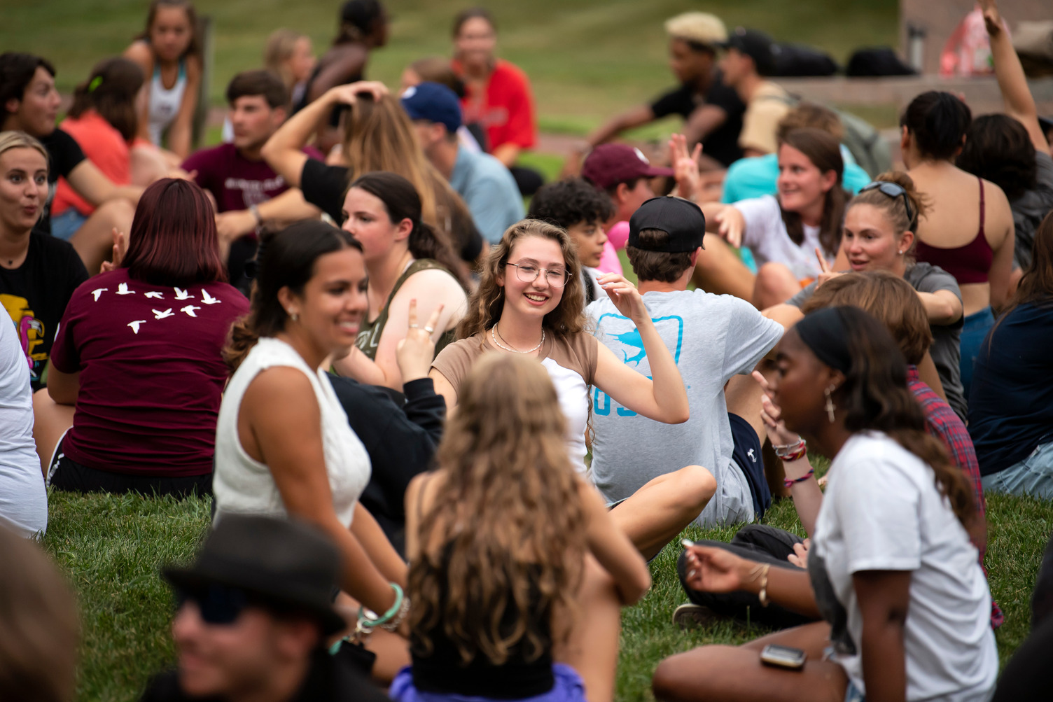 New students sit together on The Green