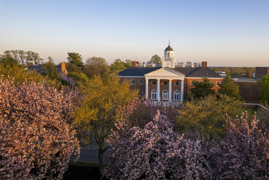 Casey Academic Center from the air with flowering trees in the foreground