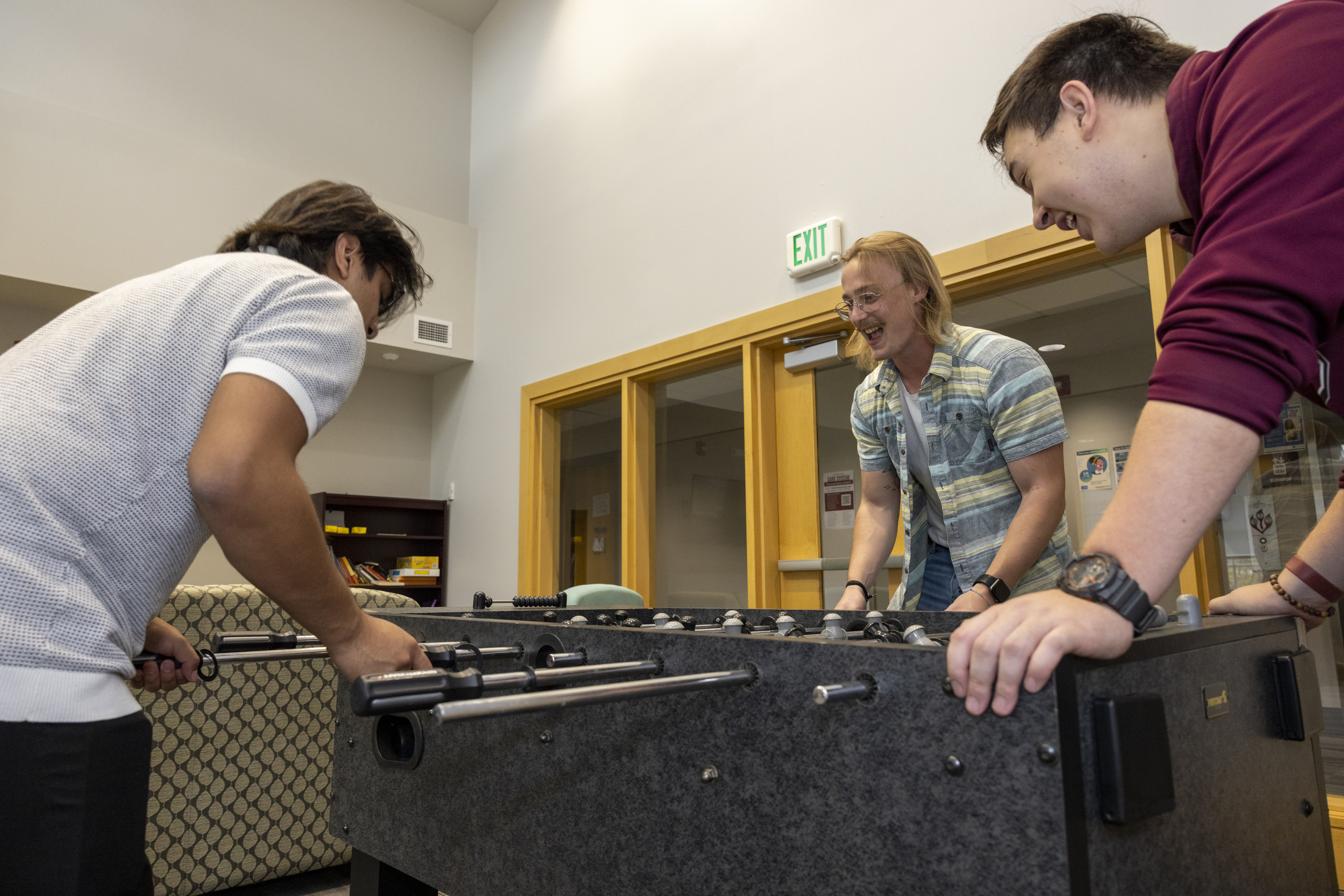 Students playing foosball in the Washington College residence halls