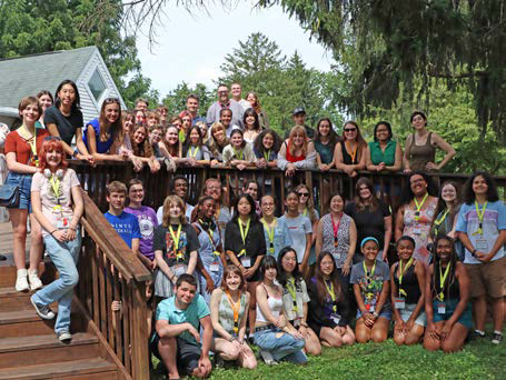 High school students attending a writing conference gathering on the deck of the Rose O'Neill Literary House at Washington College