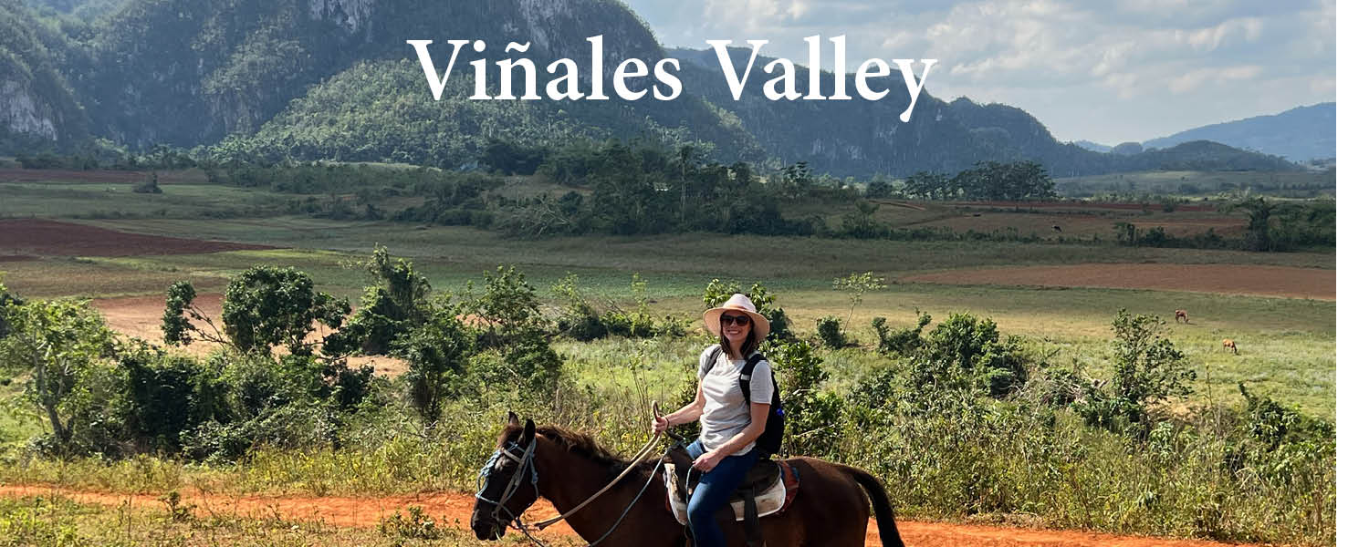 Woman riding a horse in the Viñales Valley