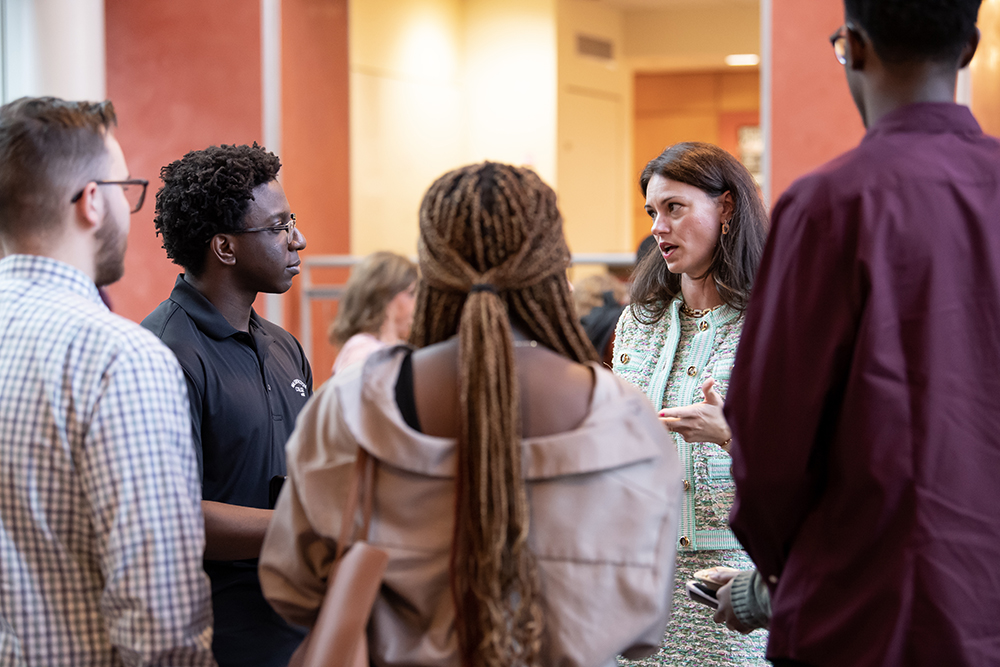 Rebecca Corbin Lorie speaks with students in the Toll Science Center