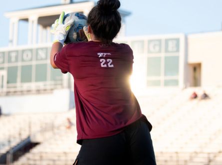 woman catching a soccer ball