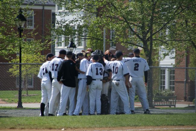 baseball players huddled together