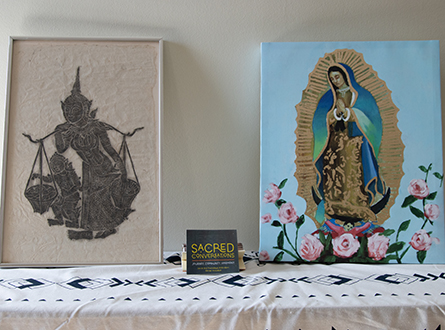 Hindu and Christian art with small sign in between reading "Sacred Conversations"