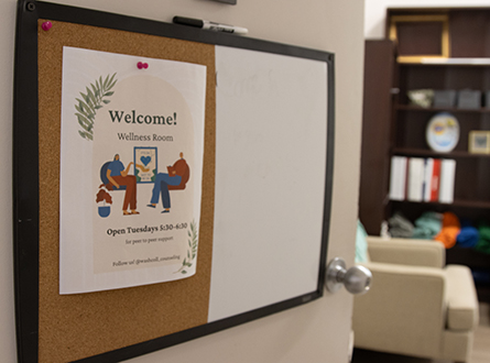 open door with sign saying "Welcome"