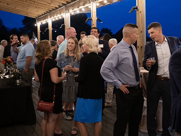 people socialize at the Washington College Athletics Hall of Fame Induction Dinner