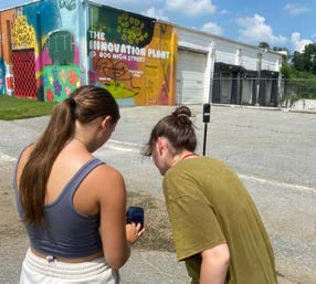 Students take 360-degree photos outside the Washington College Innovation Plant