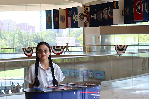 Olivia Long '26 at the Fun with Flags activity she helped update during her internship with the National Constitution Center