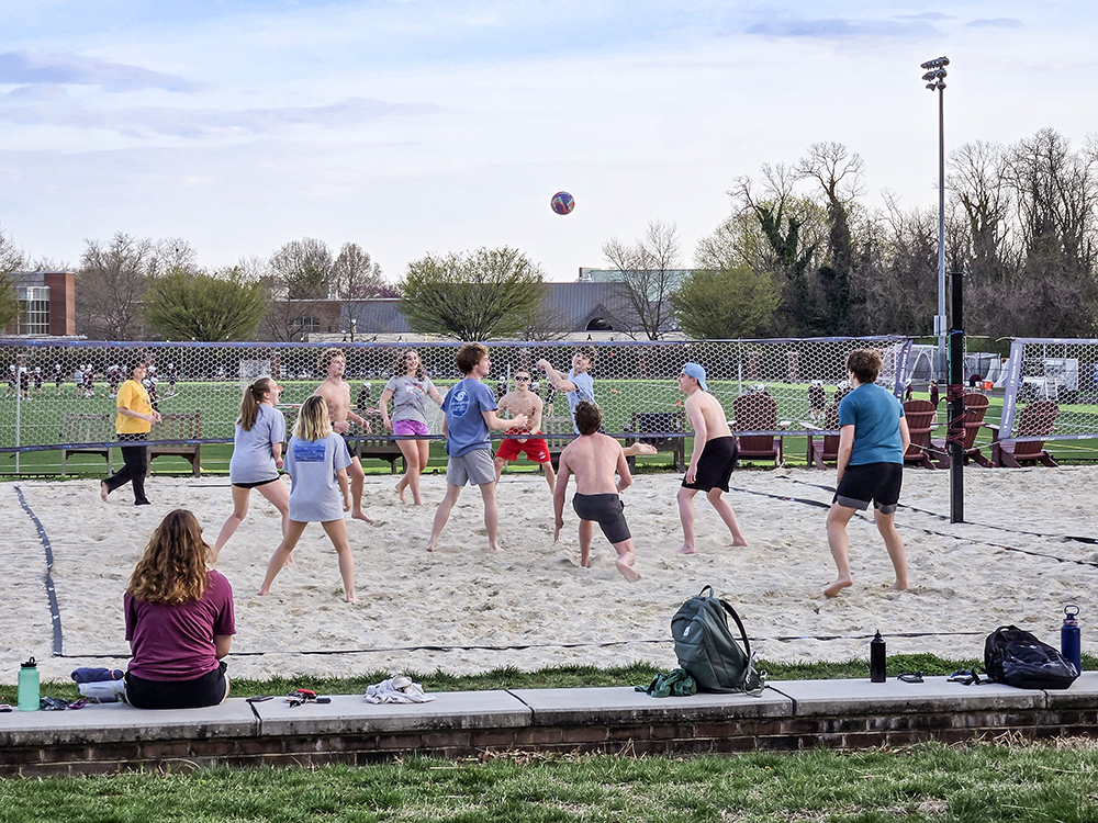 students playing beach volleyball