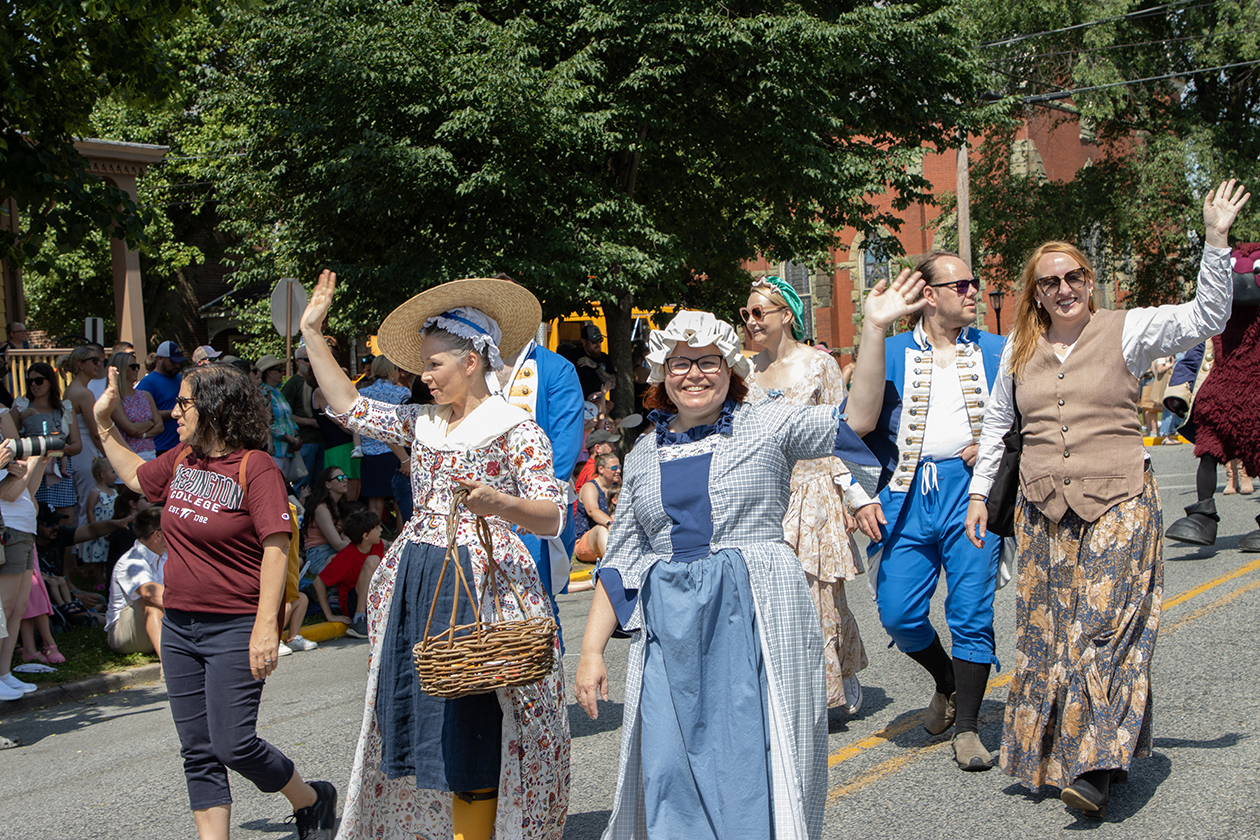 faculty walking in the tea party parade