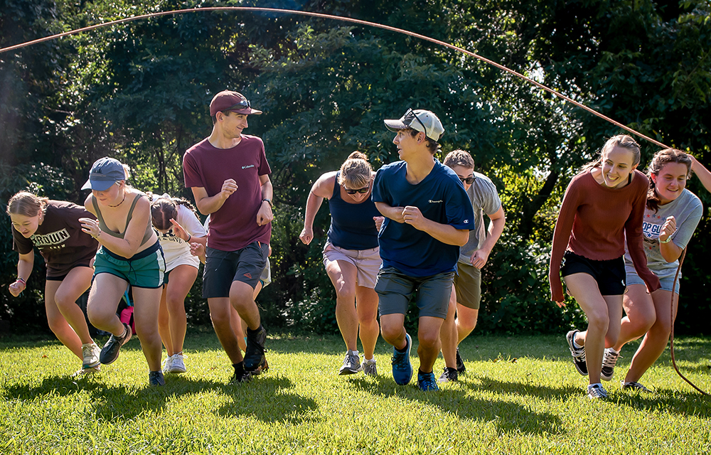 students running under a jump rope