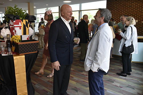 1782 Society chairman Thad Bench talking with a member