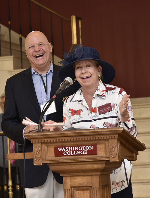 1782 Society co-chairs Thad and Renee Bench share a laugh at the podium
