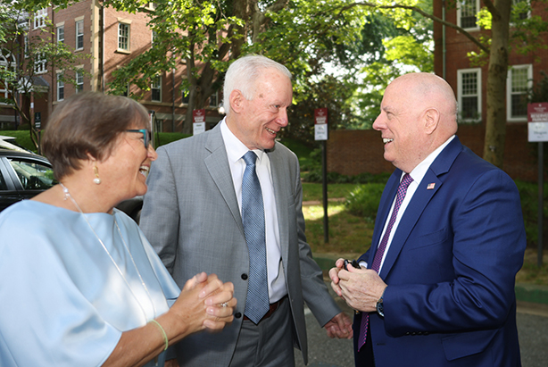 Gov. Larry Hogan speaks with President Bryan and First Lady Sue Matthews
