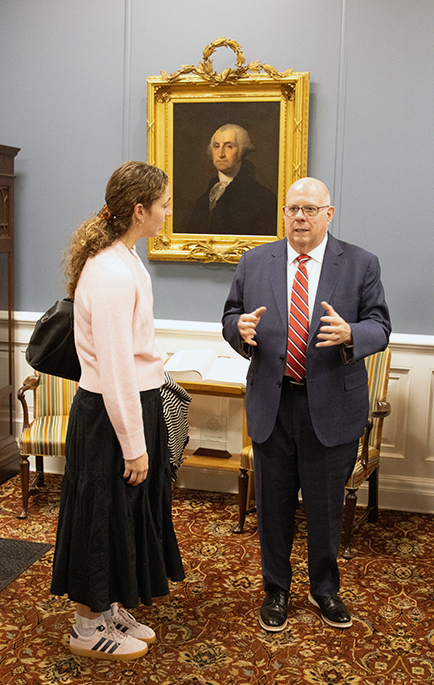 former maryland governor larry hogan talking to a washington college student