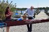 Former head rowing coach Mike Davenport christens his namesake shell.