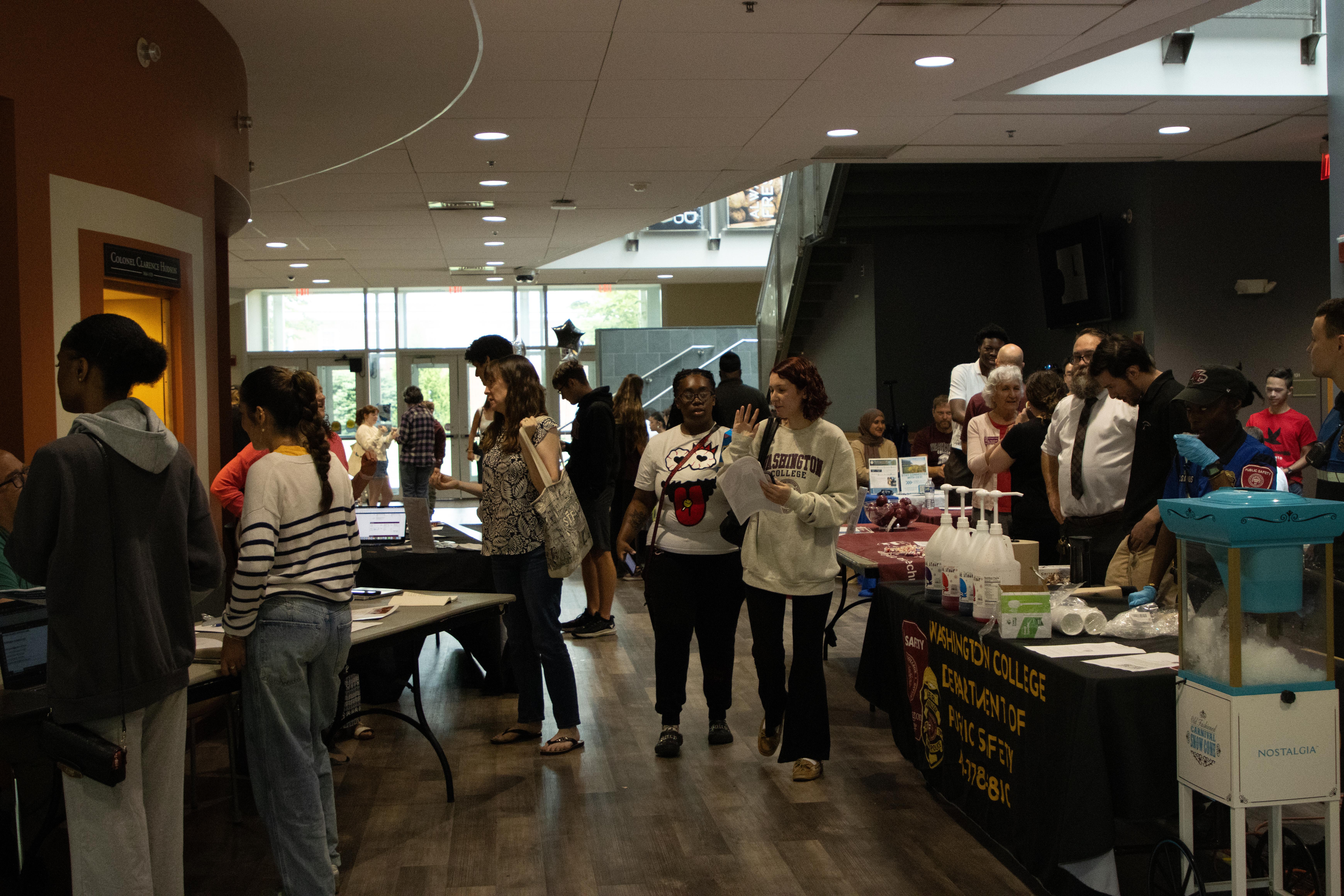 Students walk through tables set up for open house in Hodson