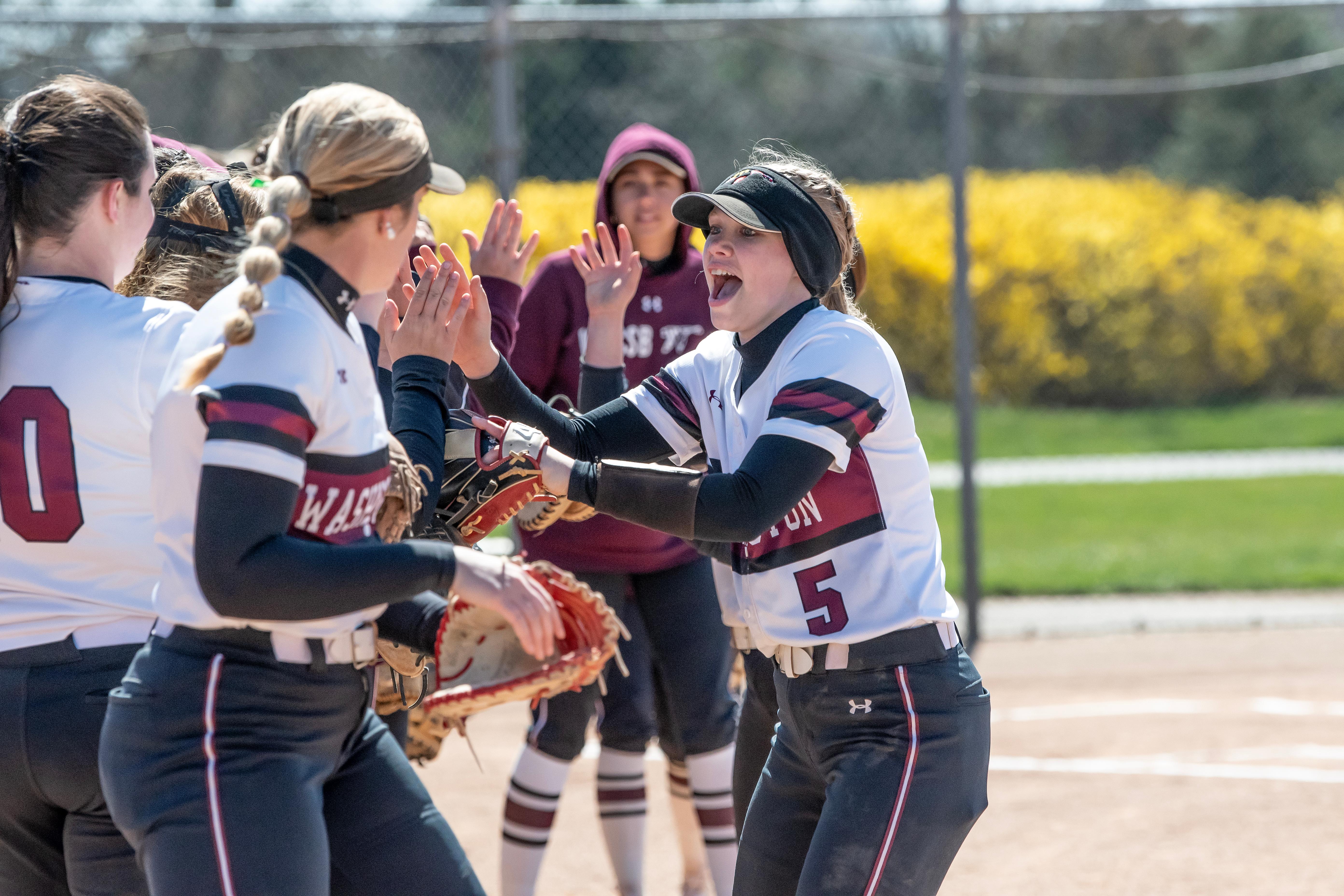 Members of softball team cheering