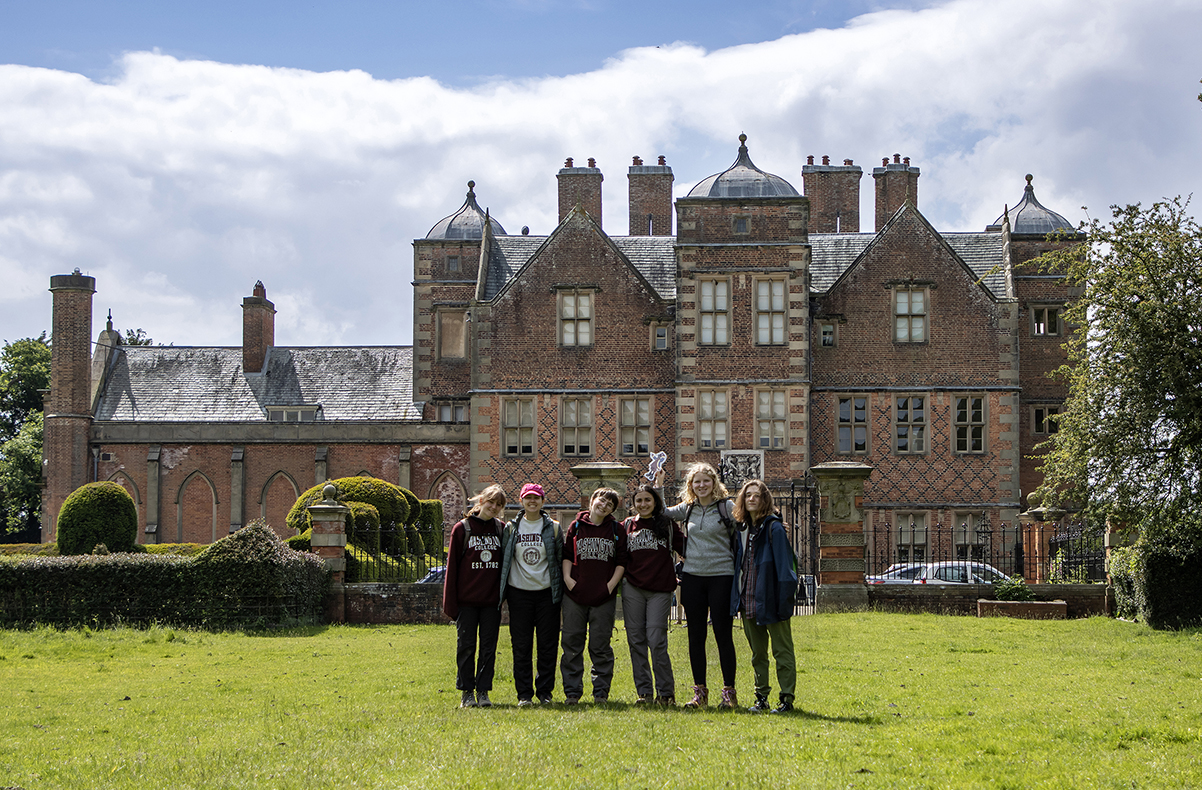 a group of Washington College students stand outside of Kiplin Hall, the ancestral home of the Calverts in England