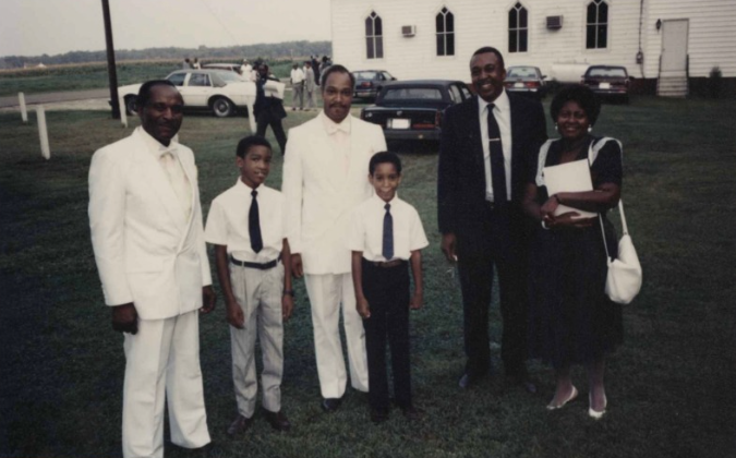 members of the community standing outside Kent County church