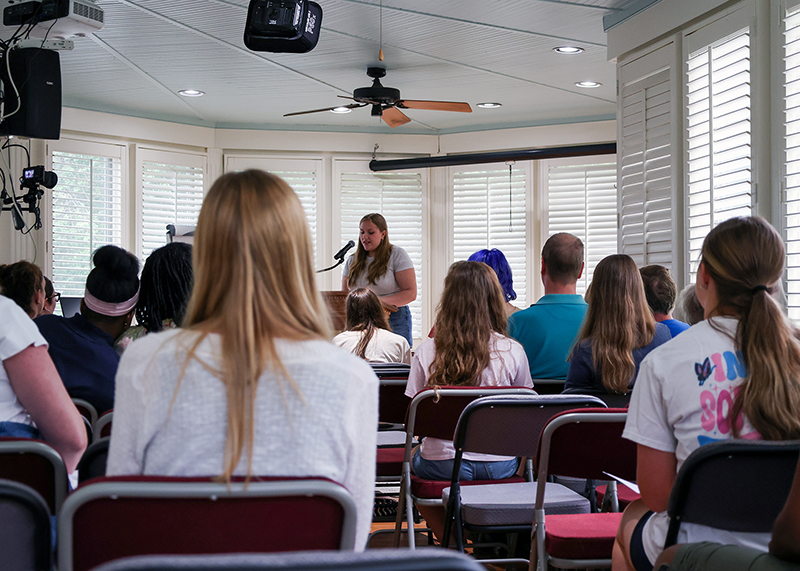 high school students participate in an open mic at the end of the one-day young writers' studio