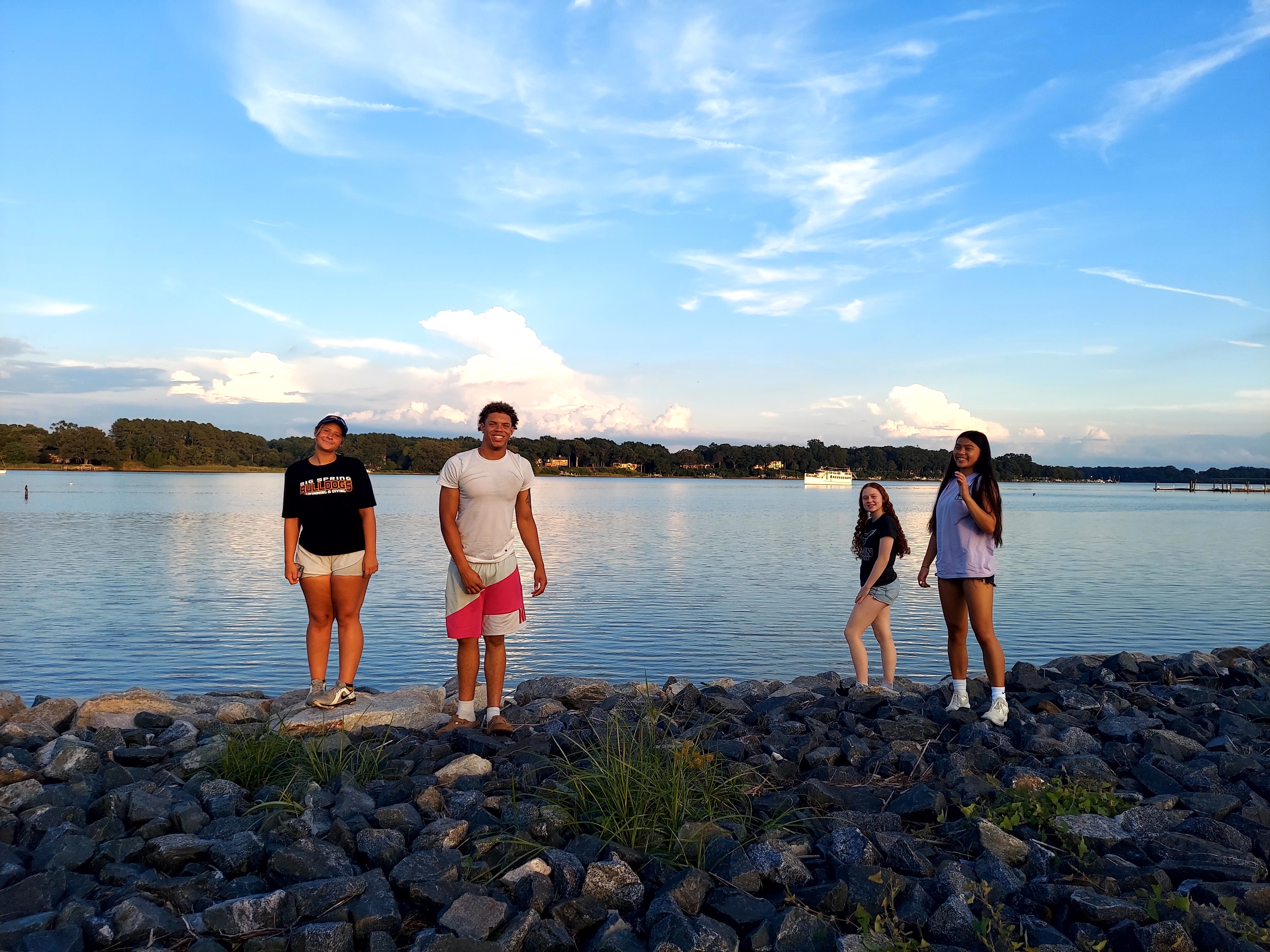 aStudents in Washington College's  Bay Science & Solutions Summer Conference pose in front of the Chestertown River. 