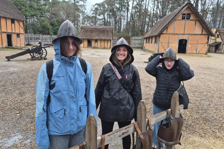 Washington College students try on colonial helmets at the historic Jamestown settlement. Washington College students try on colonial helmets at the historic Jamestown settlement.